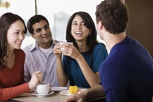 Four Friends Talking in a Cafe