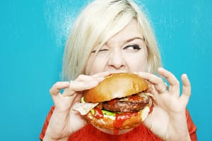 A Girl Is Eating Burger
