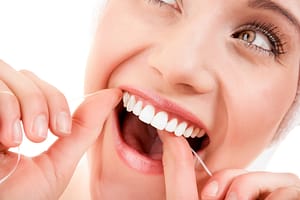 Women Flossing Close Up Oral Health
